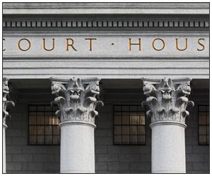 A close up view of the pillars of a court house